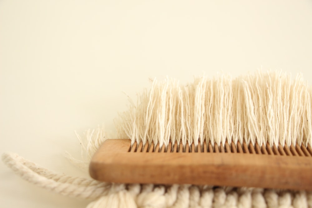 a close up of a brush on a white surface