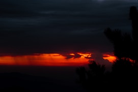 A moody, artful frame from a recent short film capturing a silhouette against a vibrant sunset.