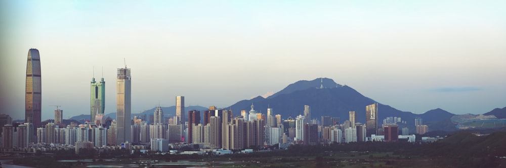 a view of a city with mountains in the background