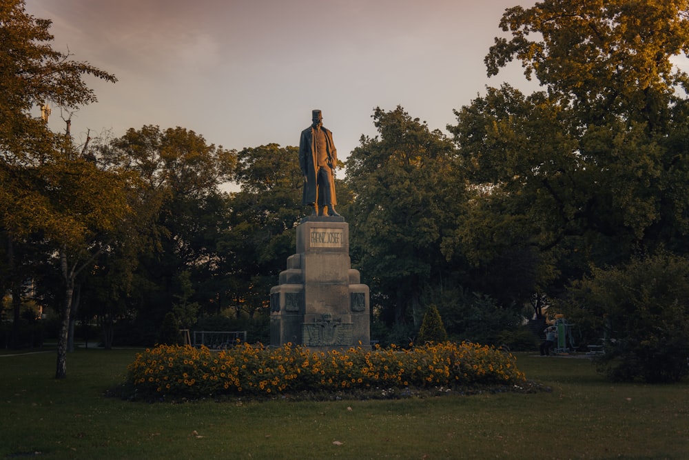 a statue of a man sitting on top of a statue