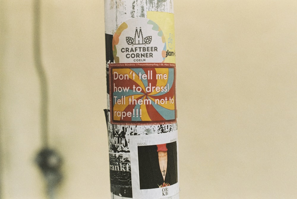 a pole with a bunch of stickers on it