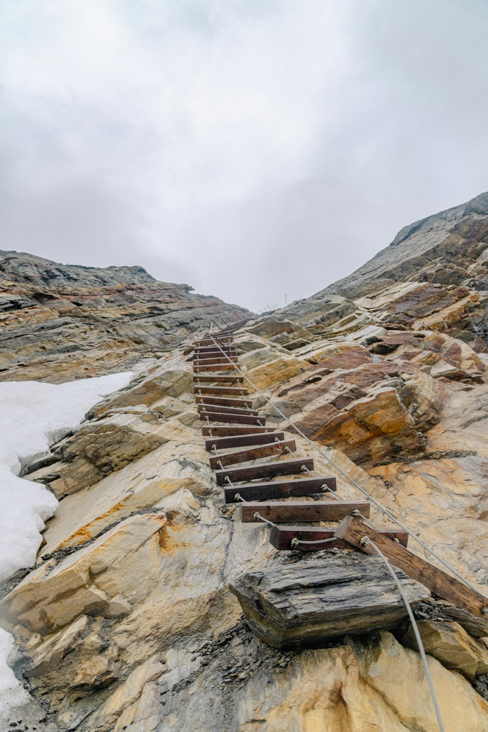 a set of stairs going up a mountain side
