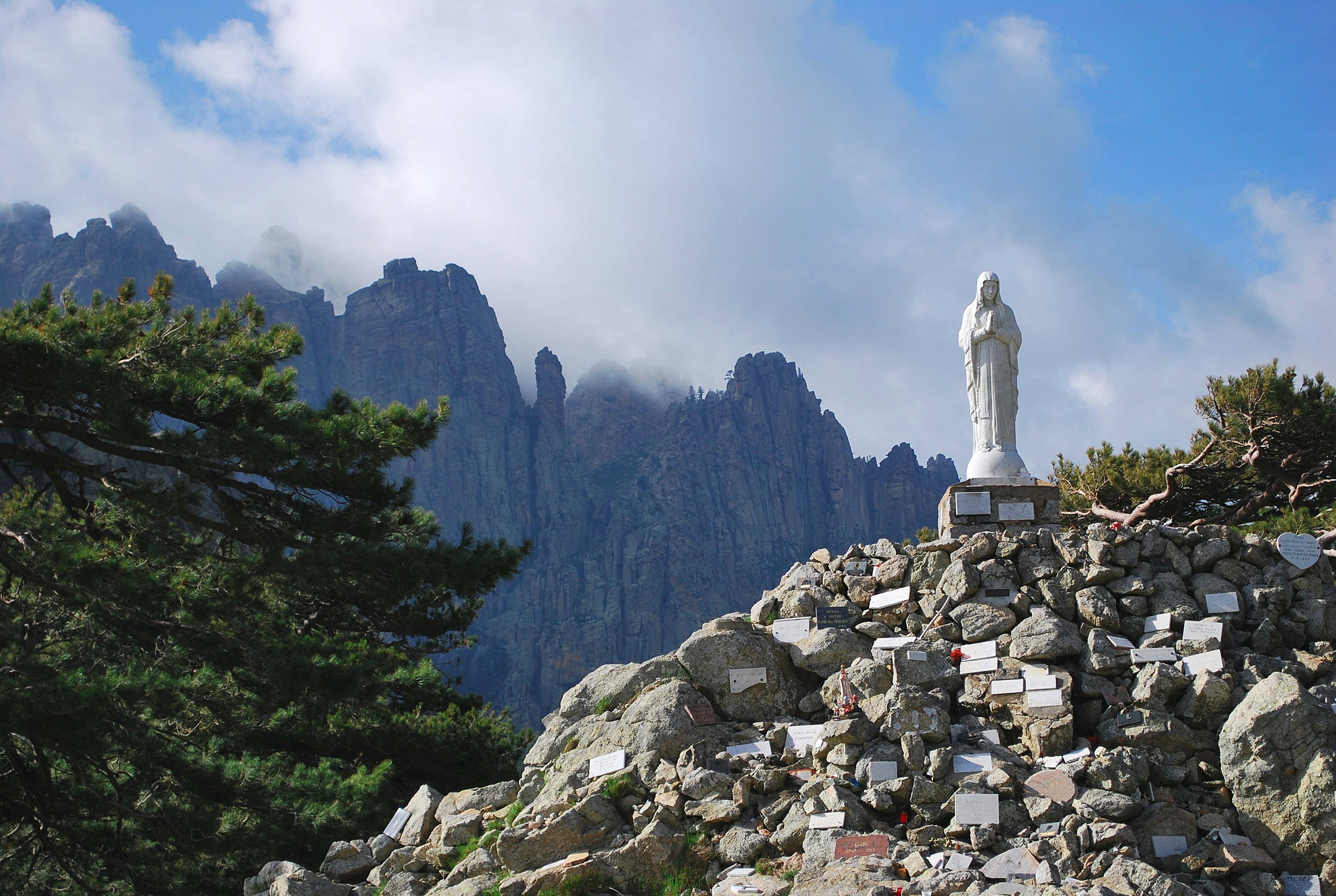 a statue on top of a pile of rocks