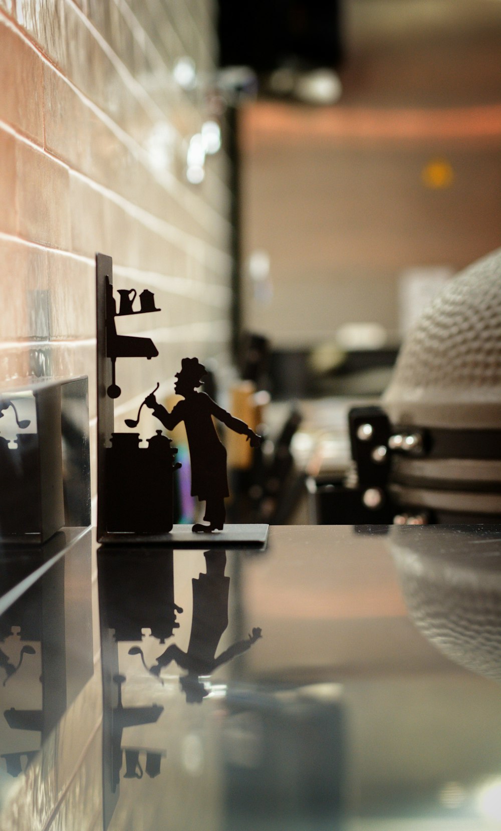 a silhouette of a man with a gun on a counter