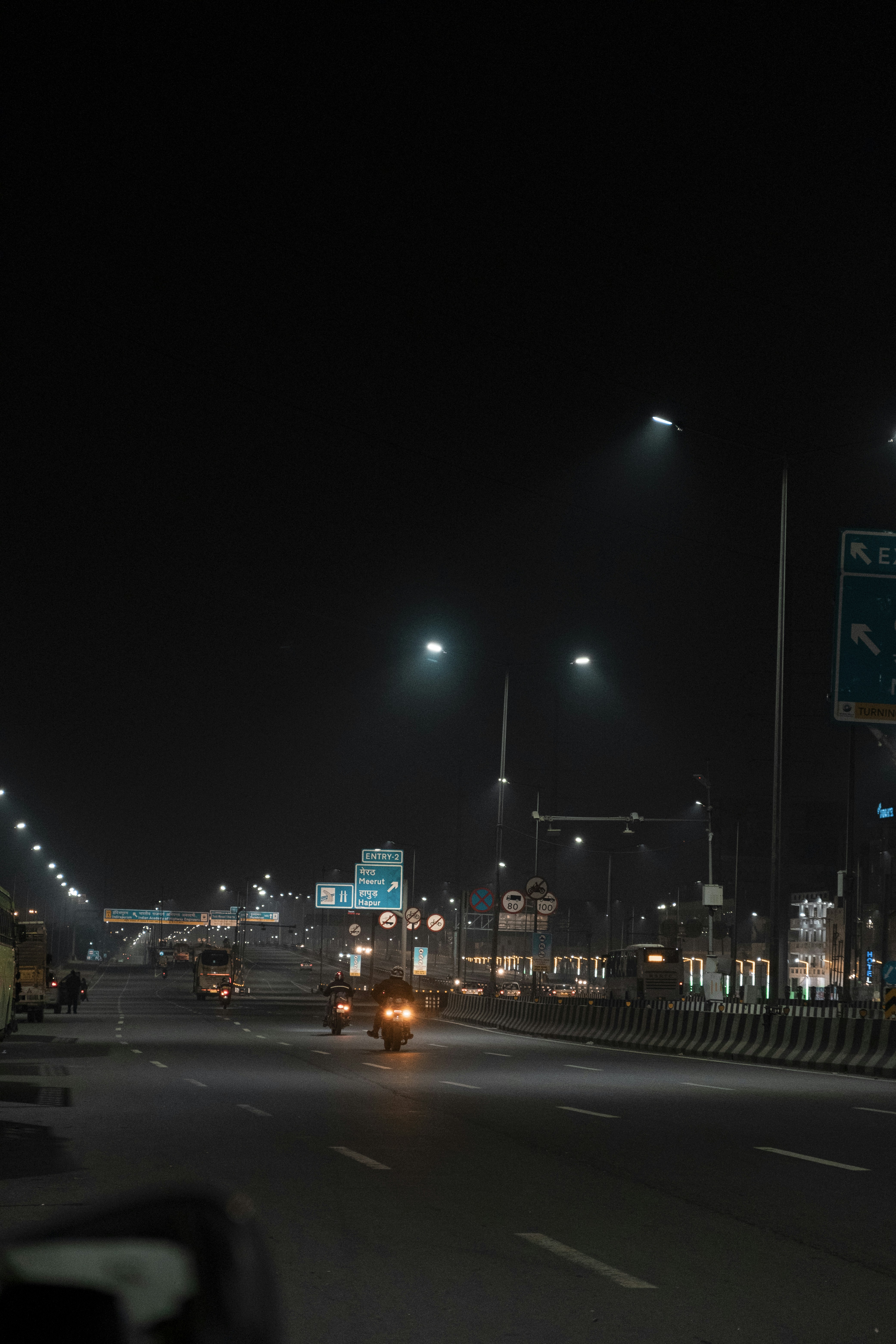 a car driving down a street at night
