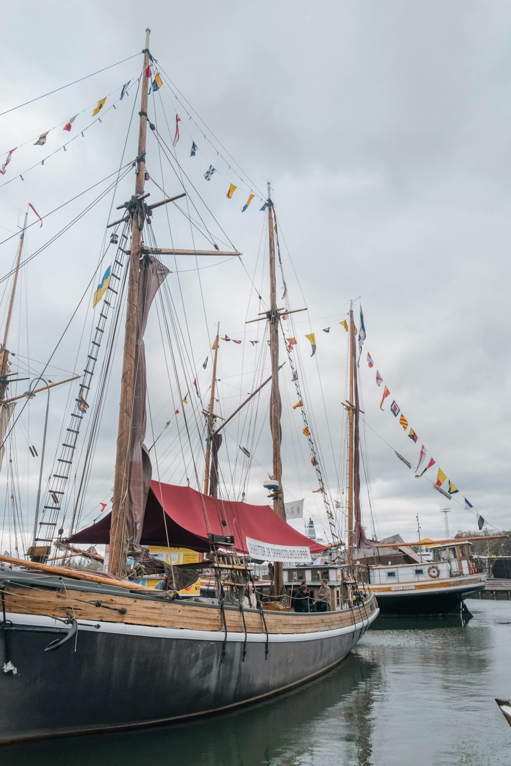 a large boat is docked at a dock