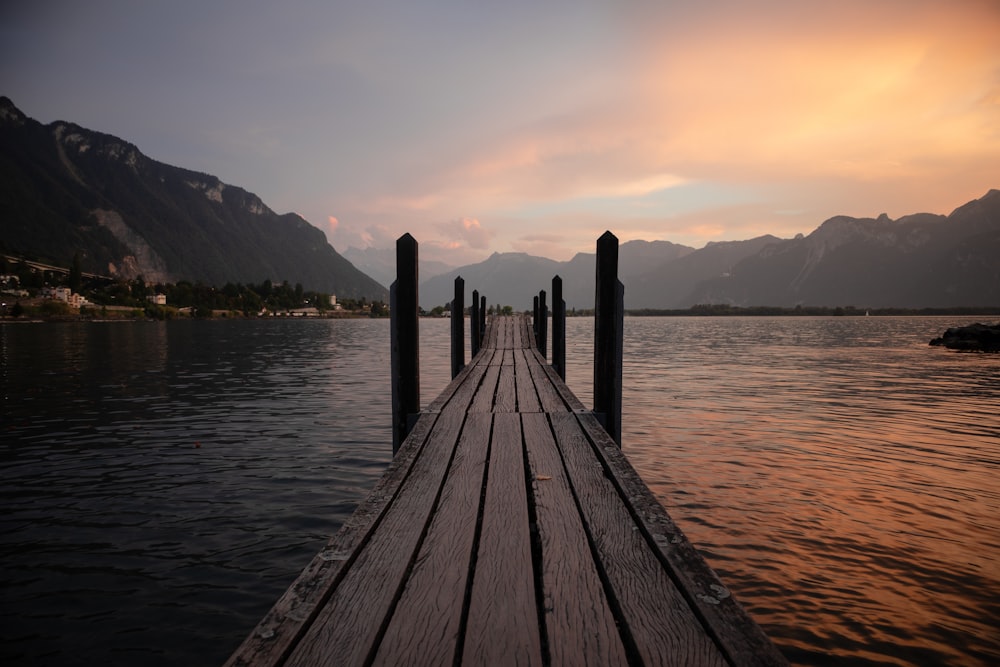 a wooden dock sitting on top of a body of water