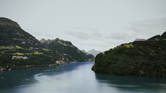 A serene mountain landscape with a peaceful river.