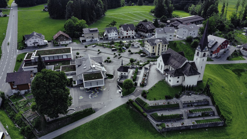 an aerial view of a small town with a church