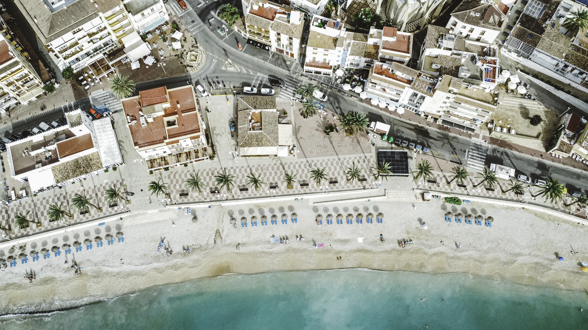 an aerial view of a beach and a city
