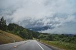 a road with a mountain in the background