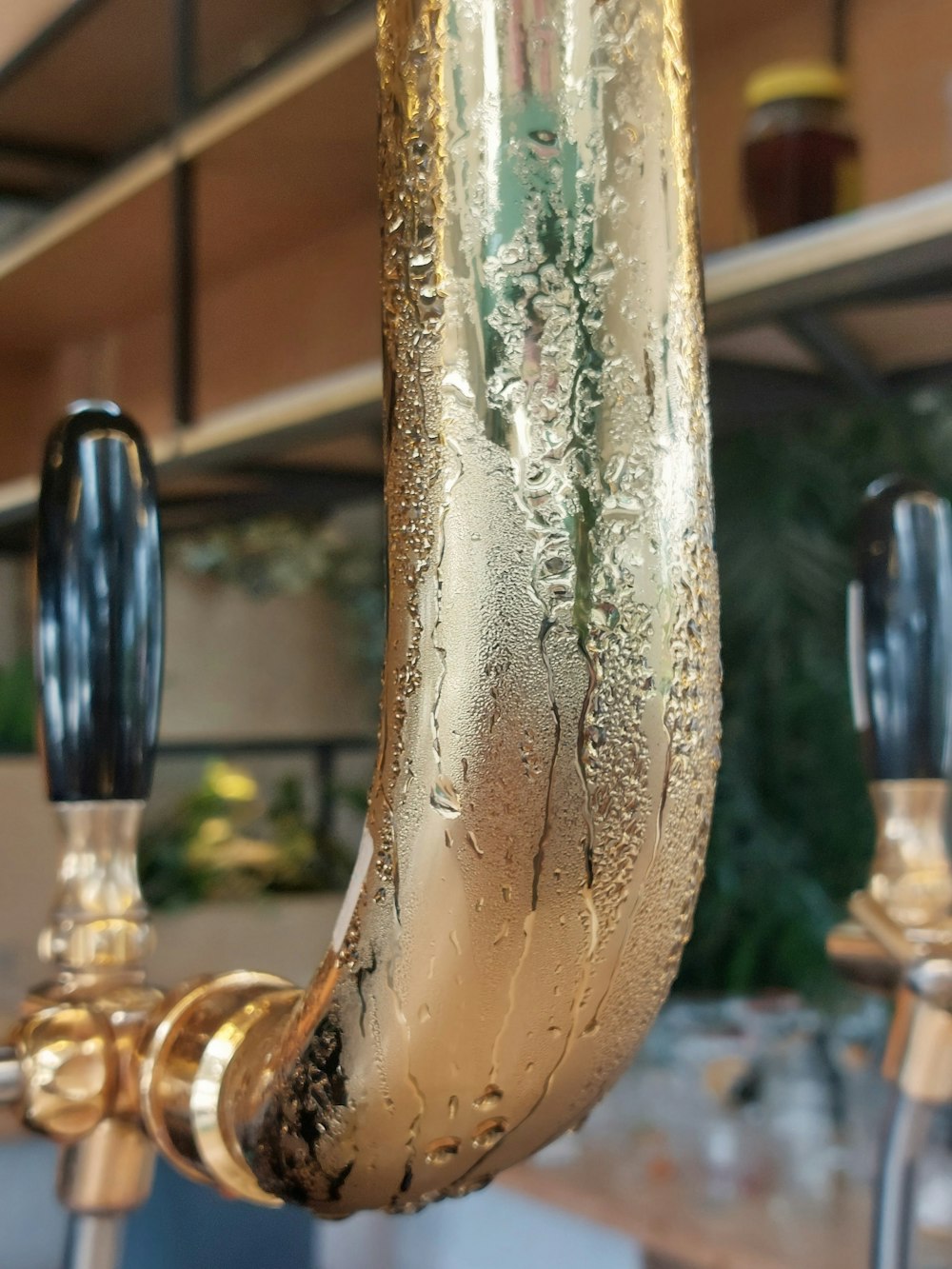 a close up of a metal object with water droplets on it