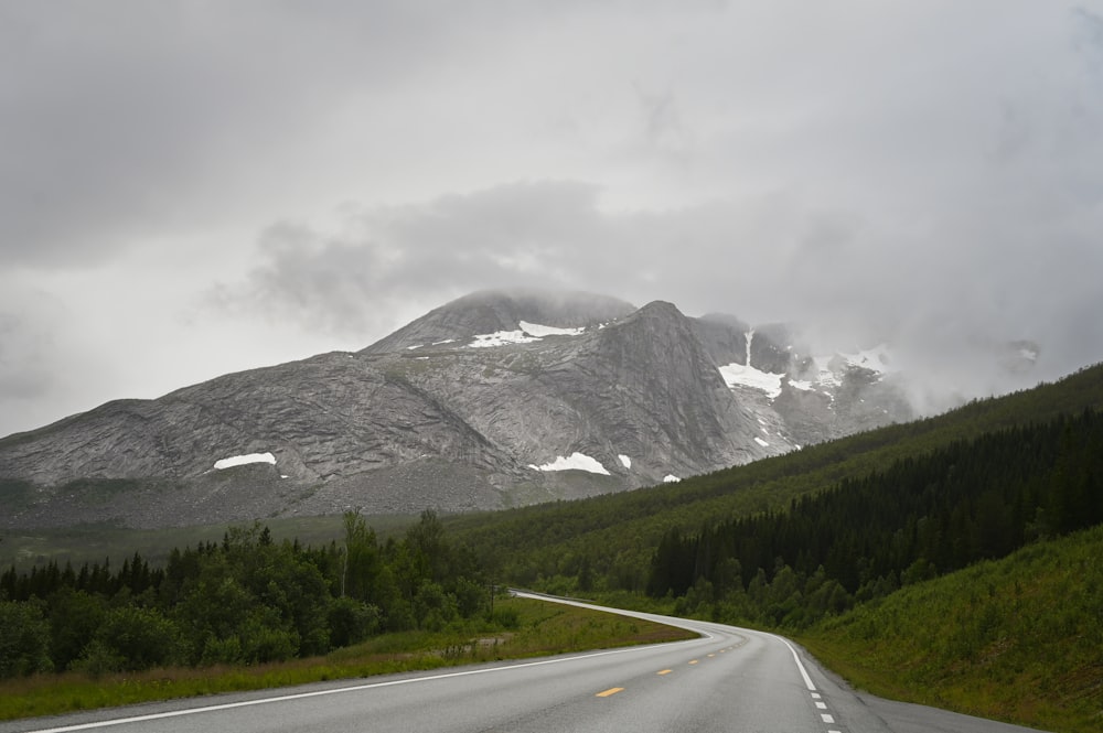 a road with a mountain in the background