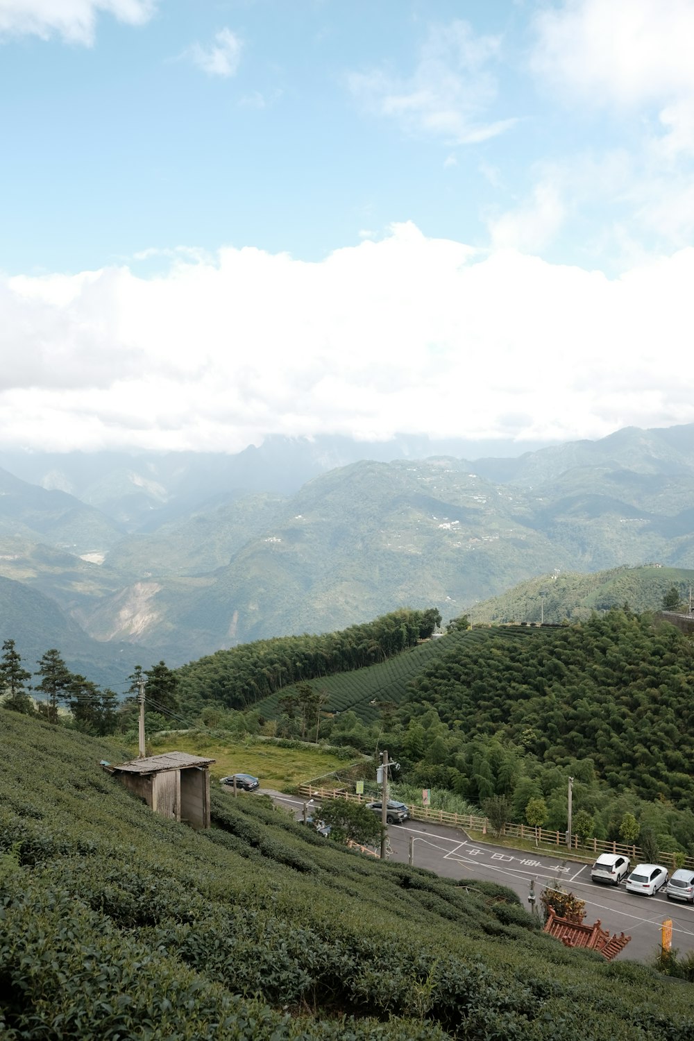 a scenic view of a road and mountains in the distance