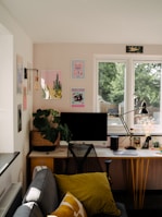 Stylish home office setup with a modern desk and ergonomic chair bathed in natural light.