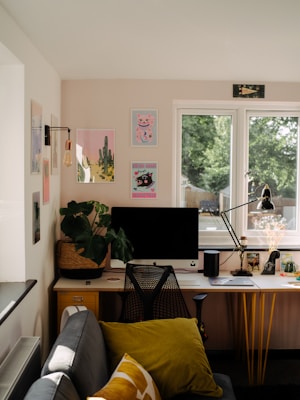 A cozy home office setup with stylish furniture and decor items on display.
