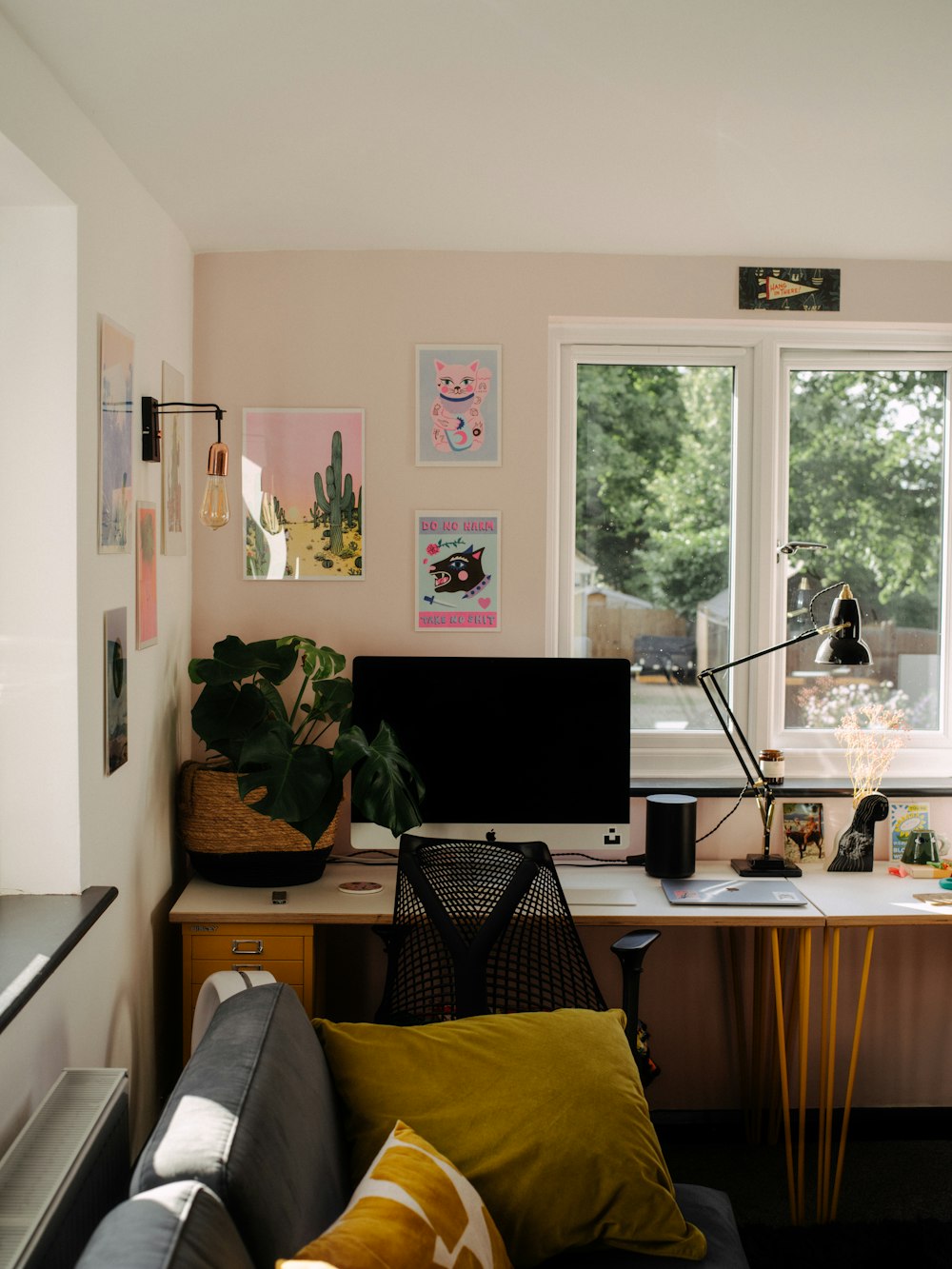 a living room with a couch and a desk