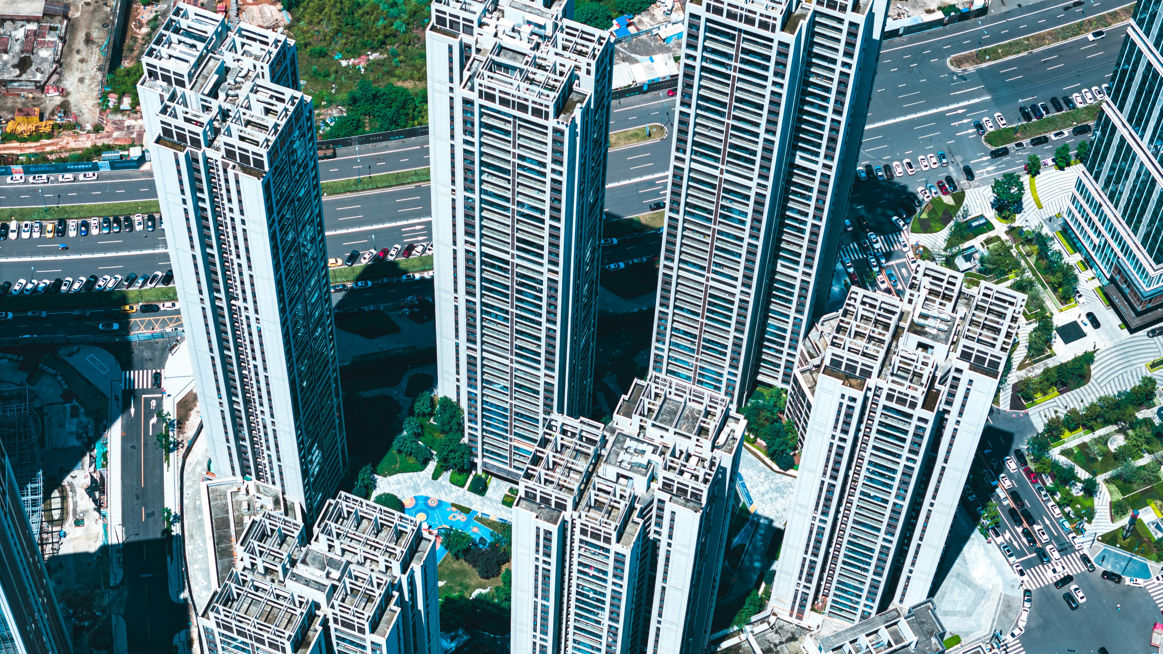 an aerial view of a city with tall buildings