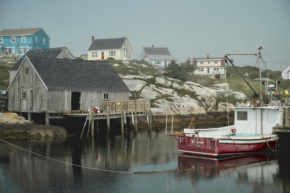 a boat is tied to a dock in the water