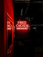 An inviting storefront with bright signage and a welcoming entrance, hinting at the fun inside Naughty Chicken LLC.