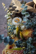 Close-up of a vibrant bouquet featuring native Australian flowers and soft greenery.