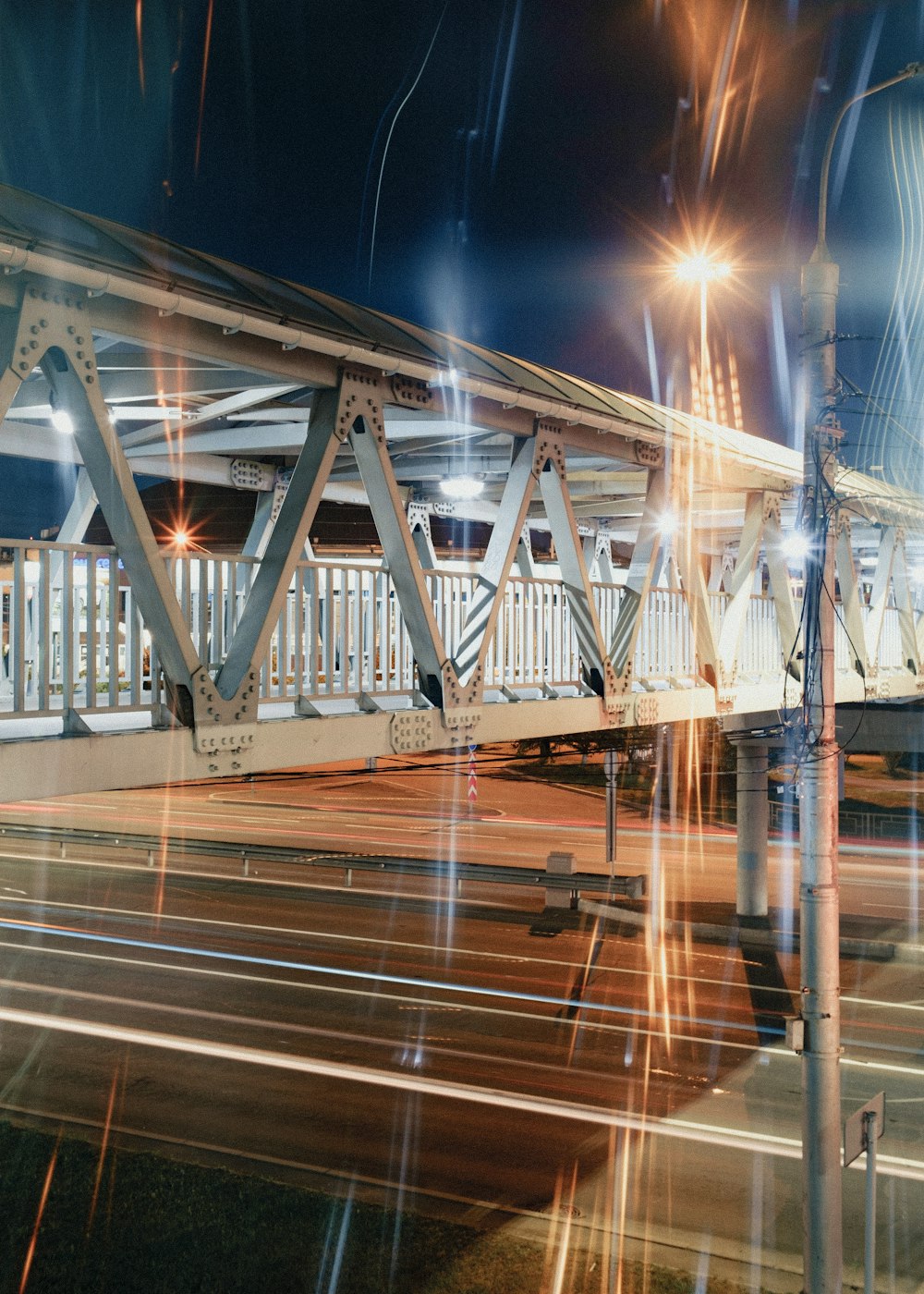 a long exposure picture of a bridge at night