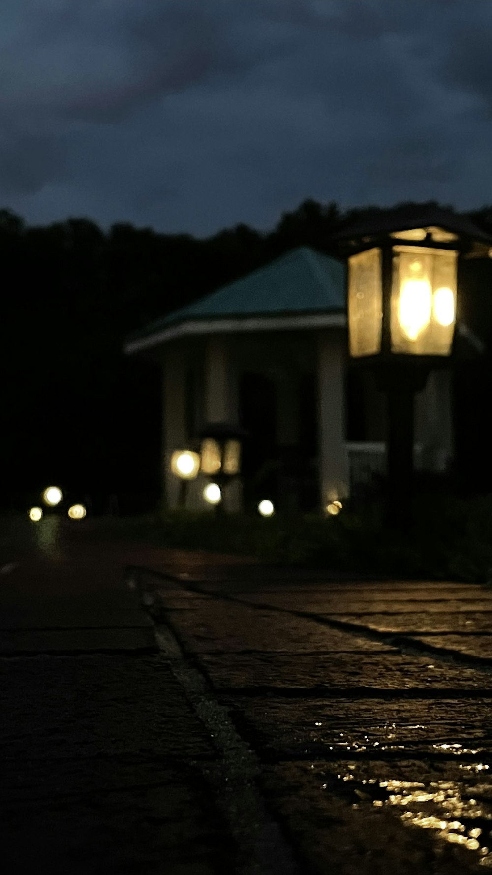 a street light sitting on the side of a road