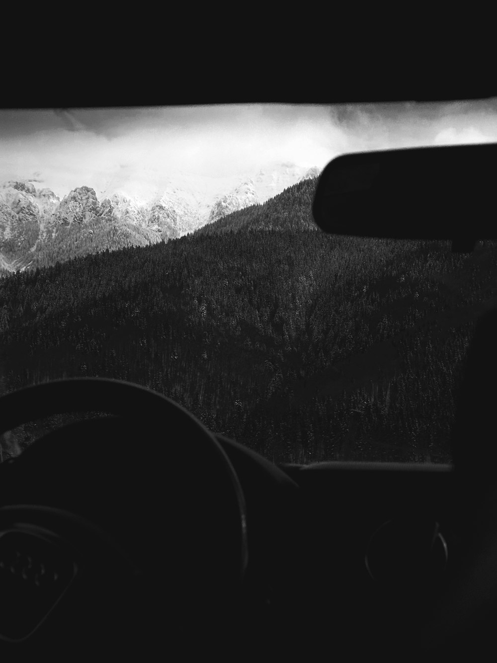 a black and white photo of a mountain range