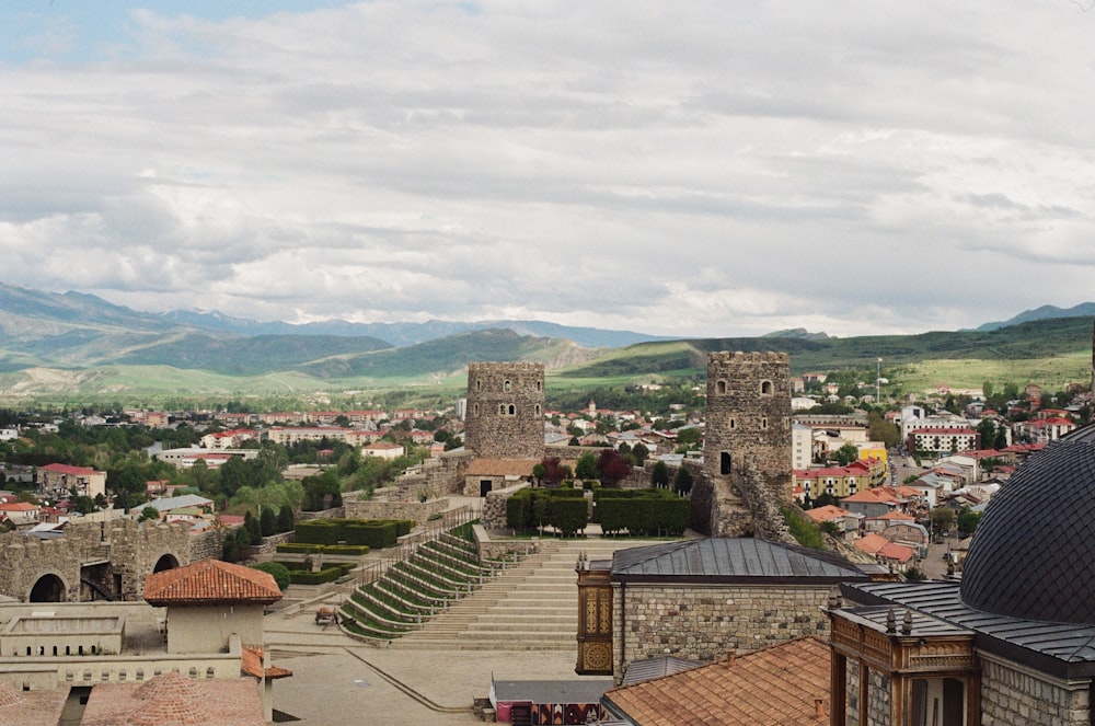 a view of a city with mountains in the background