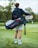 Image of a woman walking on a golf course carrying a sleek golf bag