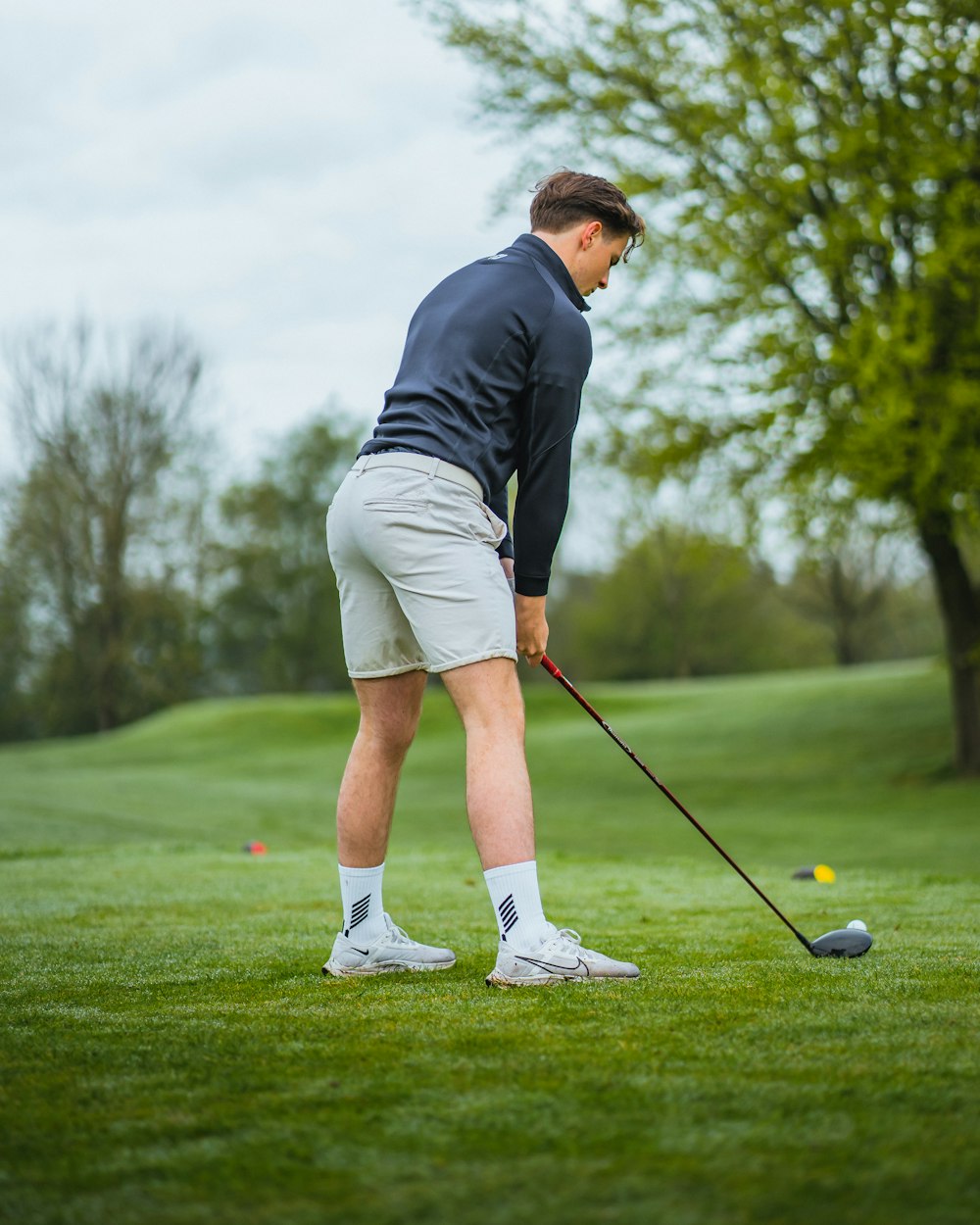 a man is playing golf on a golf course