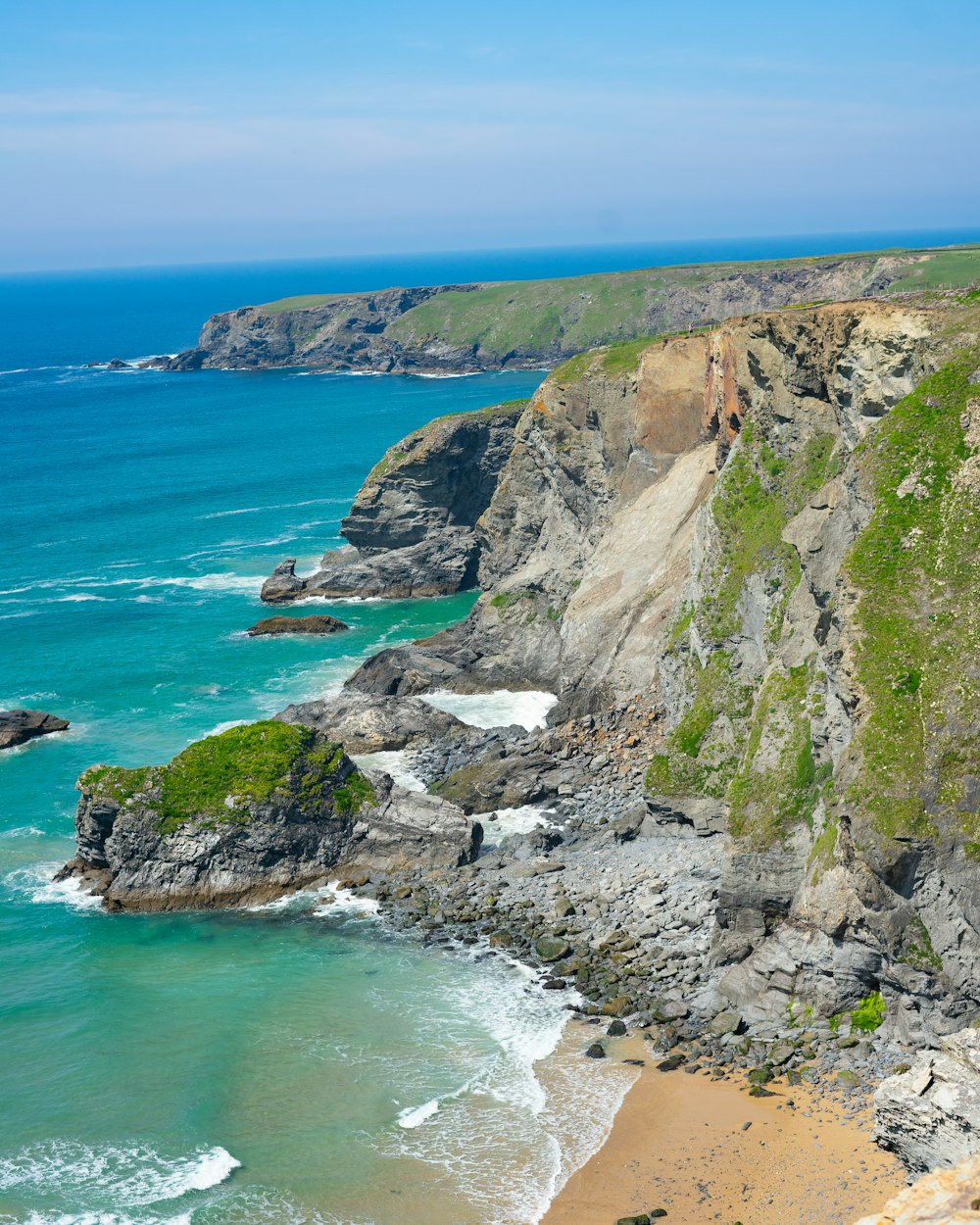 a view of the ocean from the top of a cliff