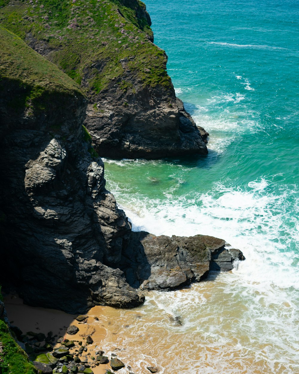 a view of the ocean from the top of a cliff