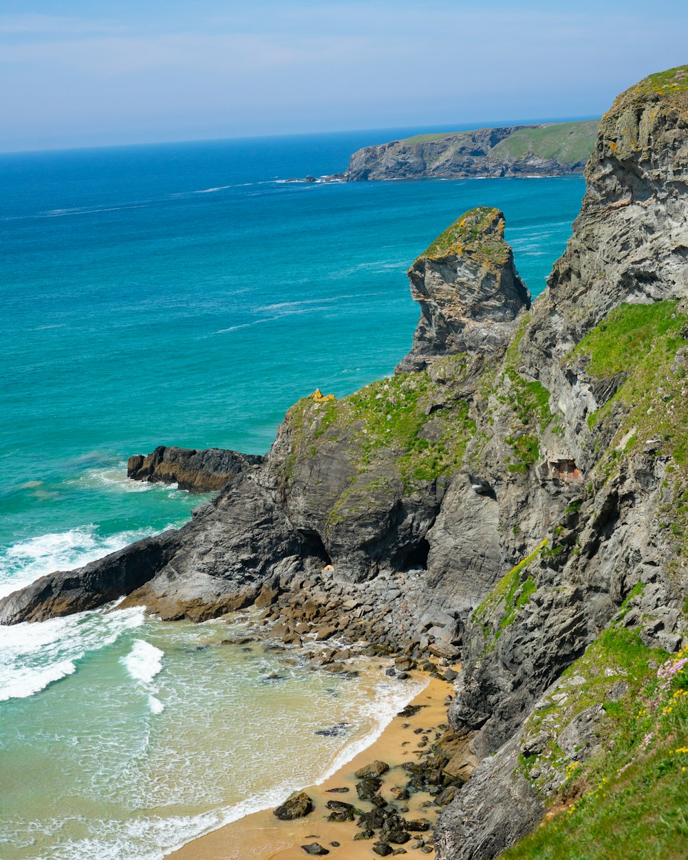 a view of the ocean from the top of a cliff