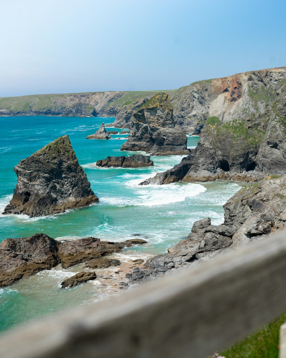 a view of the ocean from the top of a hill