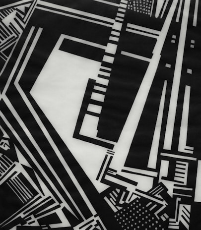 Abstract composition featuring intersecting thin black lines on white background.