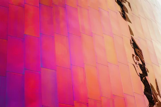 Close-up of a metal print with vibrant colors displayed in a modern hotel lobby.
