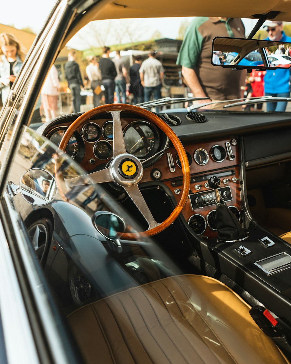 the interior of a car with a steering wheel and dashboard