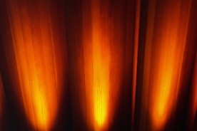 a close up of a curtain with light coming through it