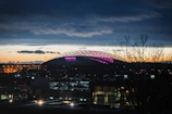 A night-time stadium lit up, symbolizing the excitement of transfer season.