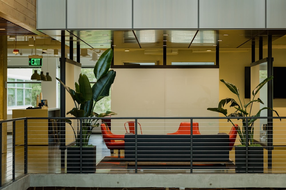 a balcony with a couch and a plant in it