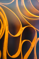 Golden lines subtly illuminating a dark textured background.
