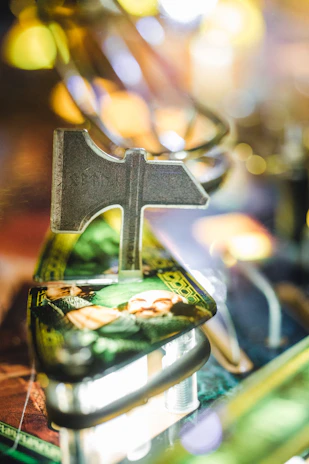 A close-up of a pinball machine featuring a night sky themed pin cover art.