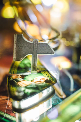 A close-up of a pinball machine featuring a night sky themed pin cover art.