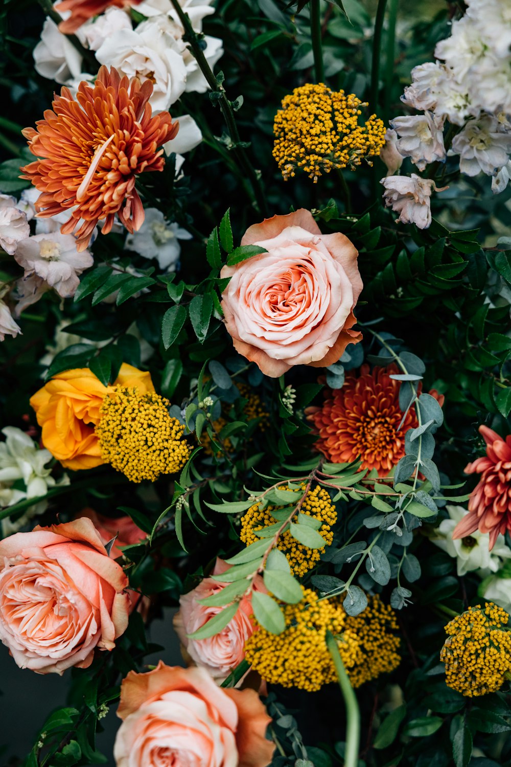 a bunch of flowers that are on a table