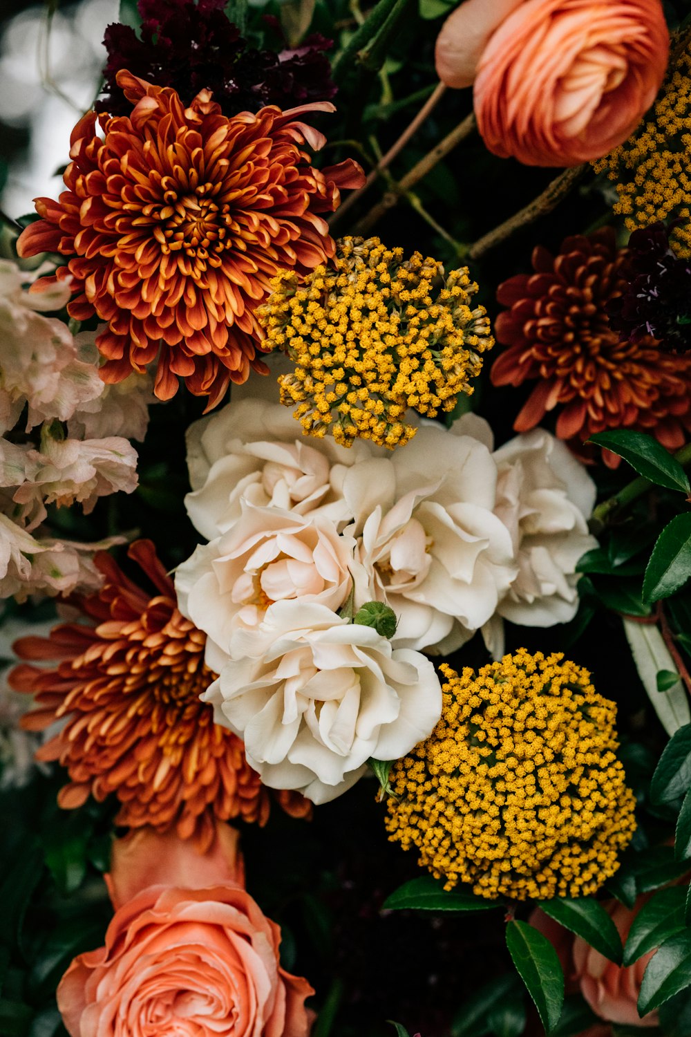 a bunch of flowers that are sitting on a table