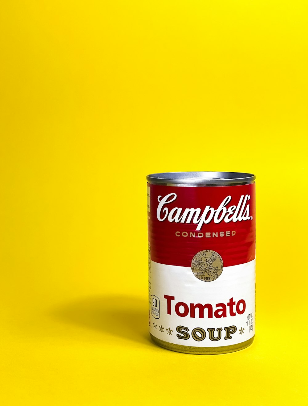 a can of soup on a yellow background