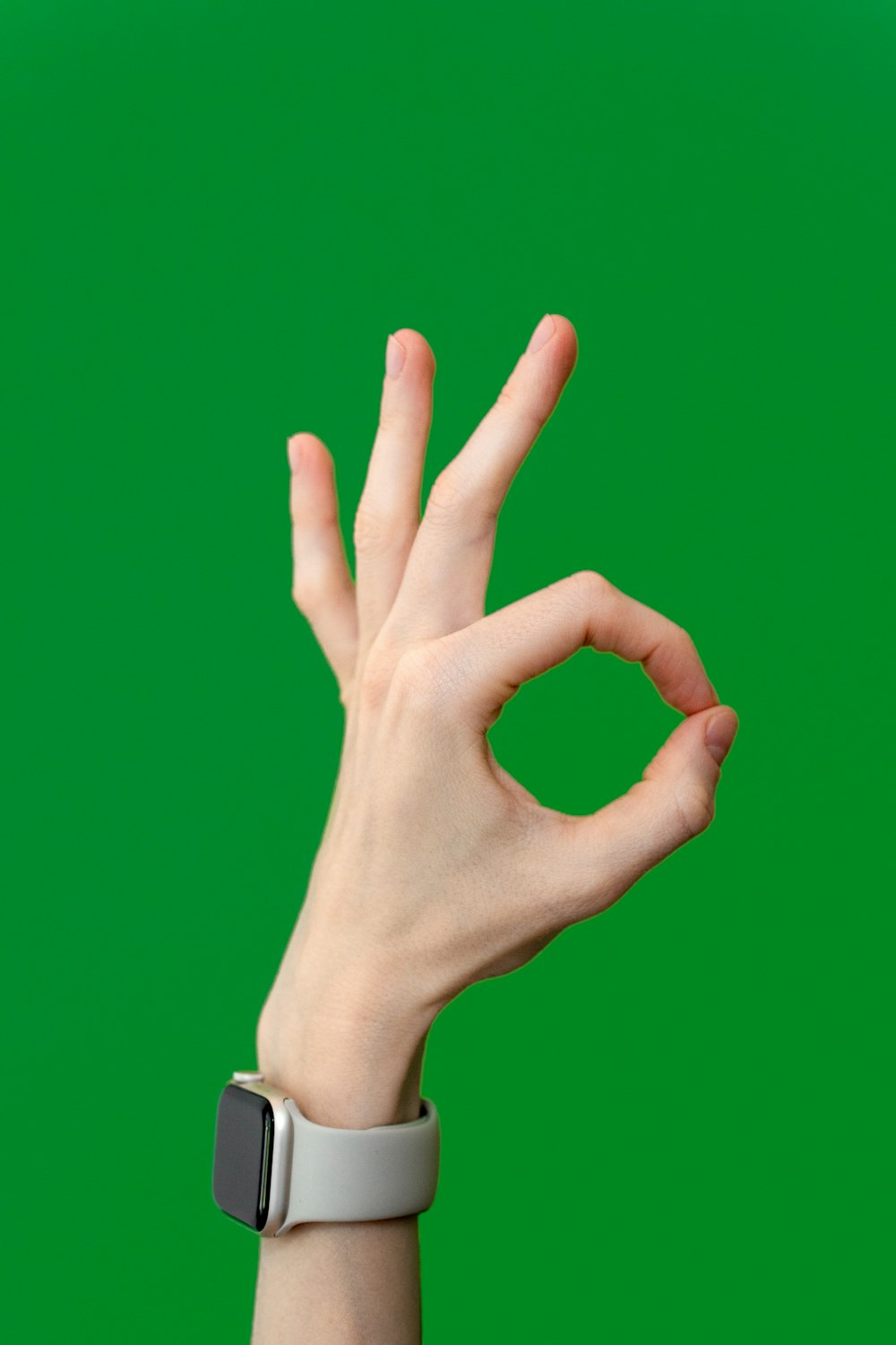 a person making a peace sign with their hand