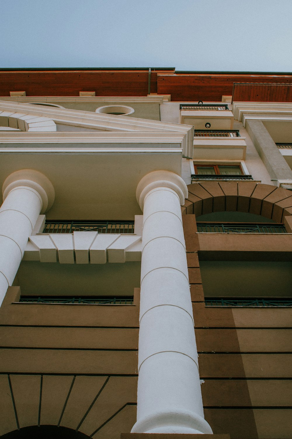 a close up of a tall building with white columns