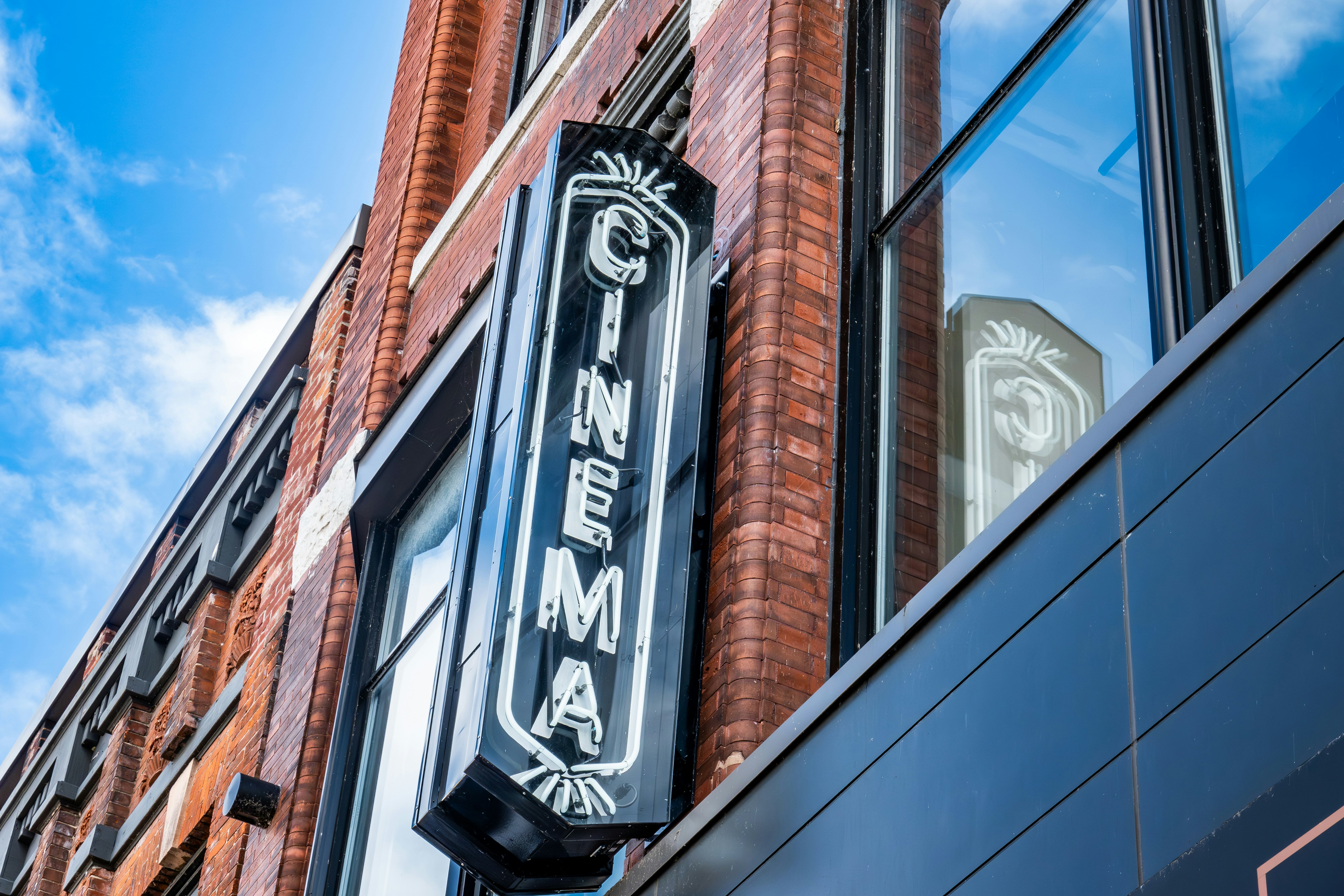 a neon sign on the side of a building